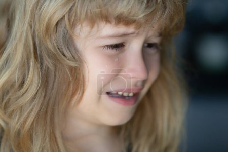 Photo for Kid crying with a tear on cheek. Child with sad expressions, crying. Sad kid crying - Royalty Free Image