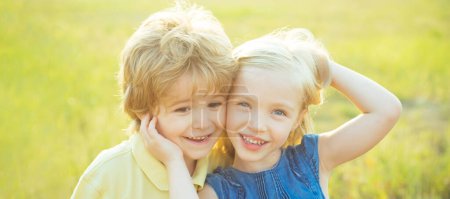 Photo for Close up portrait of two cute children outdoors. Spring banner for website header. Kids having fun in field against nature background. Romantic and love. Kid having fun in spring field - Royalty Free Image