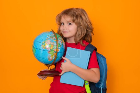 Photo for School kid with globe and book. Smart clever nerd. Caucasian blonde school boy kid pupil student going back to school. Education and knowledge - Royalty Free Image
