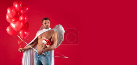 Photo for Valentines Day banner with sexy angel man. Valentines Day angel man. Sexy male with angels wings. Arrow of love, cupid, amour. February 14. Isolated on red - Royalty Free Image