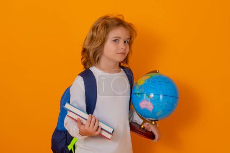 Photo for School children. School kid with globe and book. Smart clever nerd. Caucasian blonde school boy kid pupil student going back to school. Education and knowledge - Royalty Free Image
