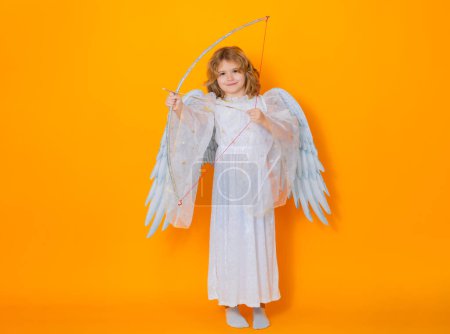 Photo for Angel with bow and arrow. Beautiful little angel. Isolated studio shot. Cute Pretty child with angel wings. Cupid, valentines day concept - Royalty Free Image