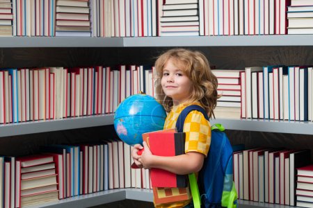Photo for School boy world globe and books. Kid boy from elementary school with book. Little student, smart nerd pupil ready to study. Concept of education and learning - Royalty Free Image