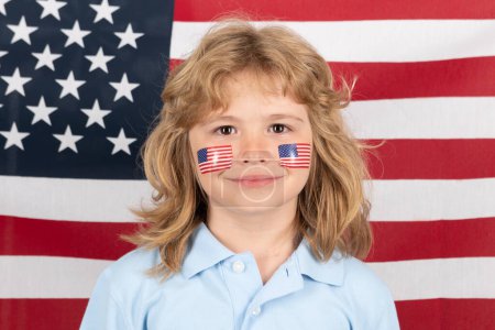 Foto de Independence day 4th of july. Child with american flag. American flag on kids cheek. American patriot, fan - Imagen libre de derechos