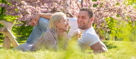 Photo for Couple in love, spring banner. Spring romantic couple in love looking at each other. Smiling face of spring happy young couple. Valentines day concept - Royalty Free Image
