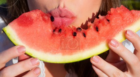 Photo for Macro watermelon in women mouth, close up. Girl eating, watermelon. Macro lips and atermelon. Summer fruits - Royalty Free Image
