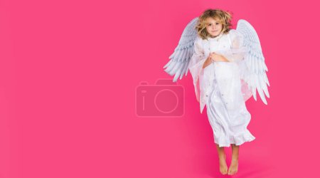 Foto de Little angel jump, kids jumping, full body in movement. Beautiful little angel. Banner for website header design - Imagen libre de derechos