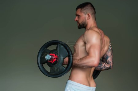 Photo for Portrait of handsome sporty man with muscular body doing weight lifting. Guy workout at gym. Fitness trainer, sport instructor, sporty man, fit model, sportsman workout. Power athletic guy bodybuilder - Royalty Free Image