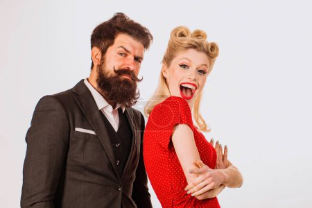 Photo for Valentines Day for retro Valentine couple. Emotional couple in love isolated at white background. Blonde woman with beautiful makeup and hairstyle standing nearher handsome bearded boyfriend - Royalty Free Image