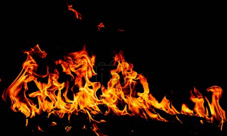 Foto de Llamarada llama de fuego ardiente sobre fondo de textura de arte - Imagen libre de derechos