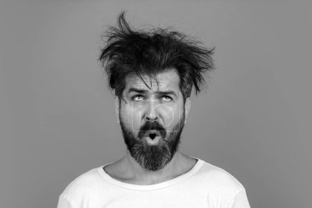 Photo for Funny and crazy. Bearded man with messy hair. Barbershop concept. Long beard and moustache - Royalty Free Image