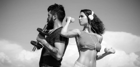 Photo for Sporty couple. Start daily workout. Sexy slim active couple with straight body sportswear outdoor blue sky background. Regular workout. Health care. Fitness lifestyle. Favorite sport. Workout result. - Royalty Free Image