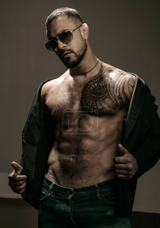 Photo for Man fashion undress. Bearded male with abs and sunglasses. Trend style macho in casual style clothes. Confidence and charisma - Royalty Free Image