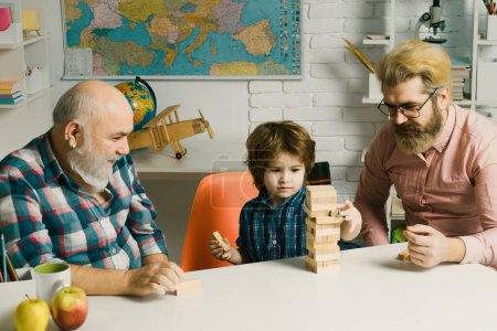 Photo for Happy man family concept laugh and have fun together. Generation of people and stages of growing up. Little boy enjoy time with elderly grandfather and young father - Royalty Free Image