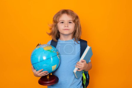Photo for School kids. Isolated portrait of cute child school boy. School and education kids concept. Clever school boy on yellow studio background - Royalty Free Image