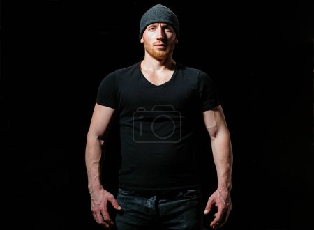 Photo for Fashionable man in black hat. Handsome bearded man. Copy space. Short beard. Portrait of confident man with red beard. Man with confident face and brutal style.Isolated on black - Royalty Free Image