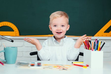 Photo for Portrait of Pupil in classroom. Home school for pupil. Home schooling. Back to school. Child near chalkboard in school classroom - Royalty Free Image