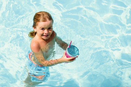 Photo for Kid swimming in pool. Children summer vacation. Summertime. Attractions concept. Swimmingpool - Royalty Free Image