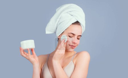 Photo for Portrait of sensual beautiful woman. Beauty face of a cheerful attractive girl with towel on head, isolated. Moisturized healthy skin, morning spa, beauty routine, facial skincare treatment - Royalty Free Image