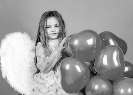 Photo for Valentines day. Happy angel girl over white. Cute child girl posing with angel wings. Angel child. Beautiful little angel - Royalty Free Image