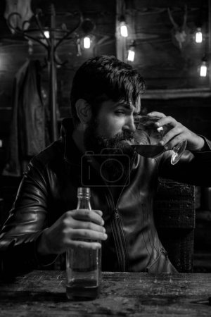 Photo for Man with beard holds glass brandy. Macho drinking. Degustation, tasting. Handsome bearded man. Do not drink and drive. - Royalty Free Image