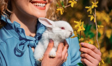 Photo for Happy easter. Egg hunt. Rabbit on close up woman mouth background. Alice in Wonderland - Royalty Free Image
