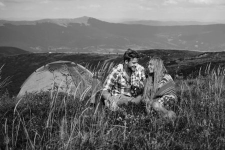 Foto de Romantic couple on camping. Outdoor adventure with friends on nature. Nature trips - Imagen libre de derechos