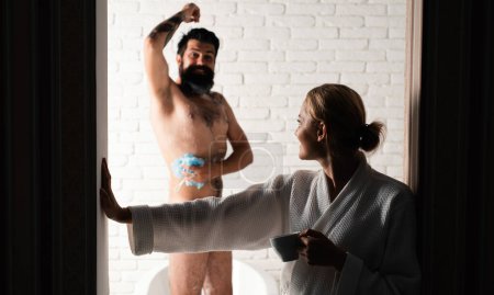 Photo for Sensual couple of woman and man trimming with razor. Bathing beauty spa family. Young adult body care morning routine. Family morning. Man and sensual woman - Royalty Free Image