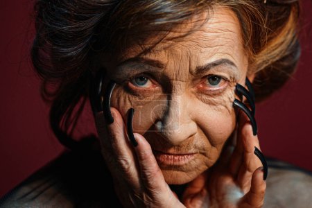 Photo for Old scary witch woman with black nails. Halloween woman - Royalty Free Image