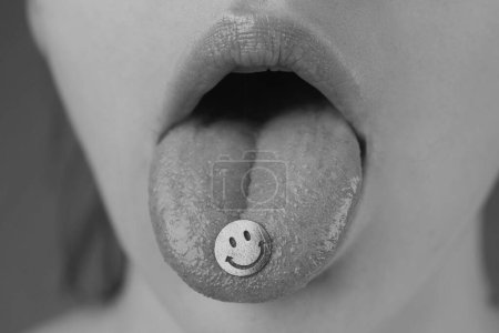 Photo for Tongue with drugs. LSD. Psychedelic hallucinogens Drug addiction - Royalty Free Image
