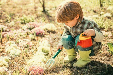 Photo for Crop planting at fields. Happy childhood concept. Kid portrait on farmland. Happy little farmer having fun on spring field - Royalty Free Image