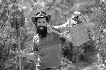 Photo for Crazy Farmer with Shovel and watering can. Garden man with tools - Royalty Free Image