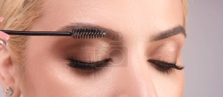 Perfect eyebrows. Natural beauty brows. Eyebrows coloring and lamination. Woman combing eyebrows. Makeup and cosmetology concept. Eyebrow shape modeling