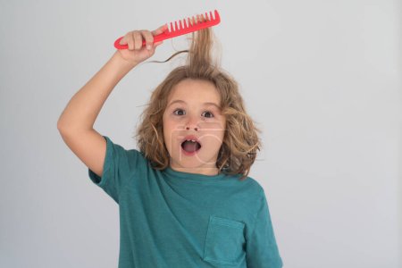 Photo for Morning kids after shower. Child with a comb and problem hair. Kids shampoo. Hair does not comb without a conditioner balm - Royalty Free Image