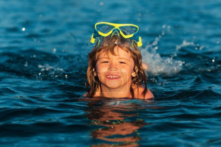 Photo for Summer child. Funny child on beach. Boy swim in sea on summer holidays. Happy kids swimming in the water. Little boy swimming in ocean or sea - Royalty Free Image