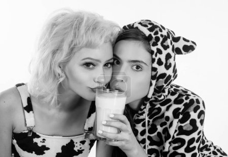 Photo for Milk your diet. Adorable women having a healthy diet. Pretty girls on dairy diet drinking milk together. Cute young women enjoying milk diet. - Royalty Free Image