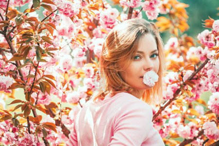 Photo for Cherry Blossom Events and Locations. Woman on Spring Cherry blossoms background - Royalty Free Image