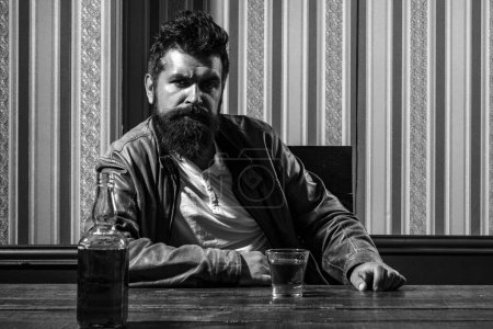 Photo for Man with beard holds glass brandy. Man holding a glass of whisky. Handsome stylish bearded man is drinking - Royalty Free Image