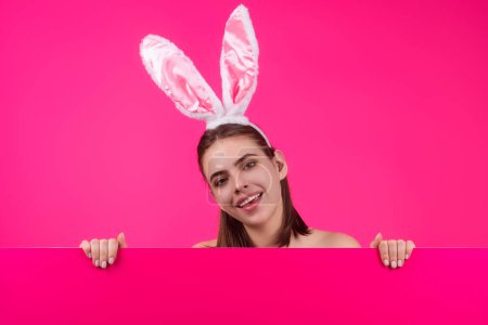 Photo for Close up photo of pretty girl wear easter fluffy bunny ears hold easter eggs, isolated studio background. Eater portrait of female bunny - Royalty Free Image