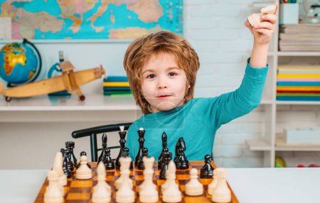 Photo for Thinking child. Little boy playing chess. Concentrated boy developing chess strategy, playing board game - Royalty Free Image