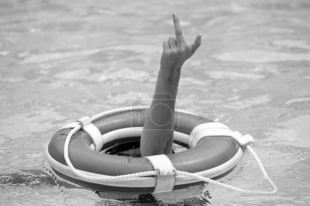 Photo for Lifebuoy helping to survive concept. Support survival or save, rescue. Ring floating in a sea, life preserver. Drown people with rised hand - Royalty Free Image