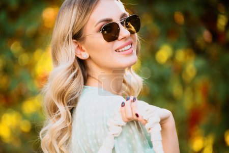 Photo for Portrait of young woman in sunglasses outdoor. Romantic girl with beauty face - Royalty Free Image