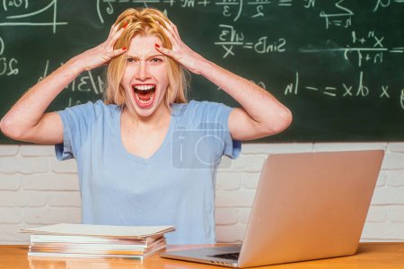 Photo for Tired student. Teachers day. Young female student ready to write exam testing. Nerd funny student preparing for university exams. Girl stressed by studying to hard screaming classroom background - Royalty Free Image