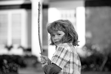 Photo for Negative child emotion. Kids aggression. Angry boy with stick. Kid adaptation. Bully. Bullying concept. nervous breakdown - Royalty Free Image