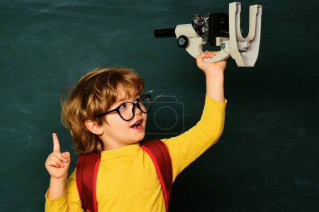 Photo for Little children at school lesson. Private school. Blackboard copy space. Hard exam. Science education concept - Royalty Free Image