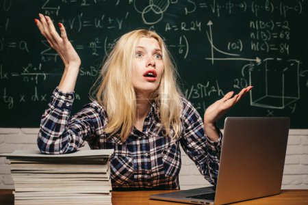 Photo for Back to school. Tired student learning at home. Knowledge day. Education and campus people concept. Girl stressed by studying to hard screaming classroom background - Royalty Free Image
