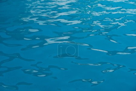 Photo for Ripped water in swimming pool. Surface of blue swimming pool, background of water - Royalty Free Image