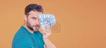 Photo for Man with money cash. 100 dollars banknotes. Portrait of man holding money. Dollar bills, credit, online banking - Royalty Free Image