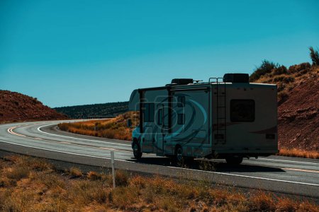 Photo for Vacation on the American Road 66. Traveling in Camper Van. Family vacation travel RV, holiday trip vacation. Caravan or recreational vehicle motor home trailer on a mountain road in America - Royalty Free Image