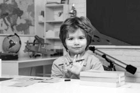 Photo for Individual tutoring. Education. Little student boy happy with an excellent mark - Royalty Free Image